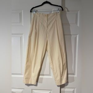 COS pleated tapered trousers with elastic waistband.